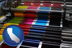 california an offset printing press with CMYK ink rollers
