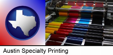 an offset printing press with CMYK ink rollers in Austin, TX