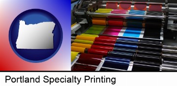 an offset printing press with CMYK ink rollers in Portland, OR