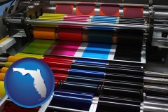 florida map icon and an offset printing press with CMYK ink rollers