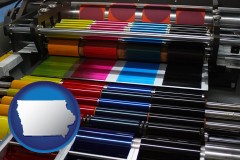 iowa map icon and an offset printing press with CMYK ink rollers