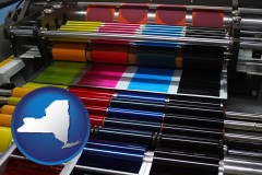 new-york map icon and an offset printing press with CMYK ink rollers