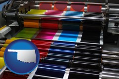 oklahoma map icon and an offset printing press with CMYK ink rollers