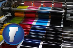 vermont map icon and an offset printing press with CMYK ink rollers